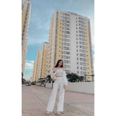 Wide-leg silk pants with high-rise waist and tailored silhouette for elevated day-to-evening style